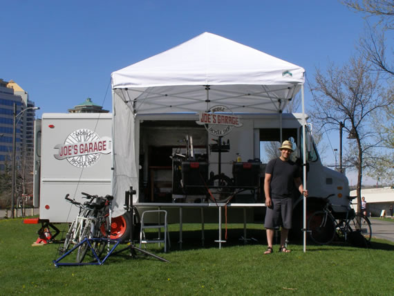 Joe with the original mobile tent setup on the pathway in 2011