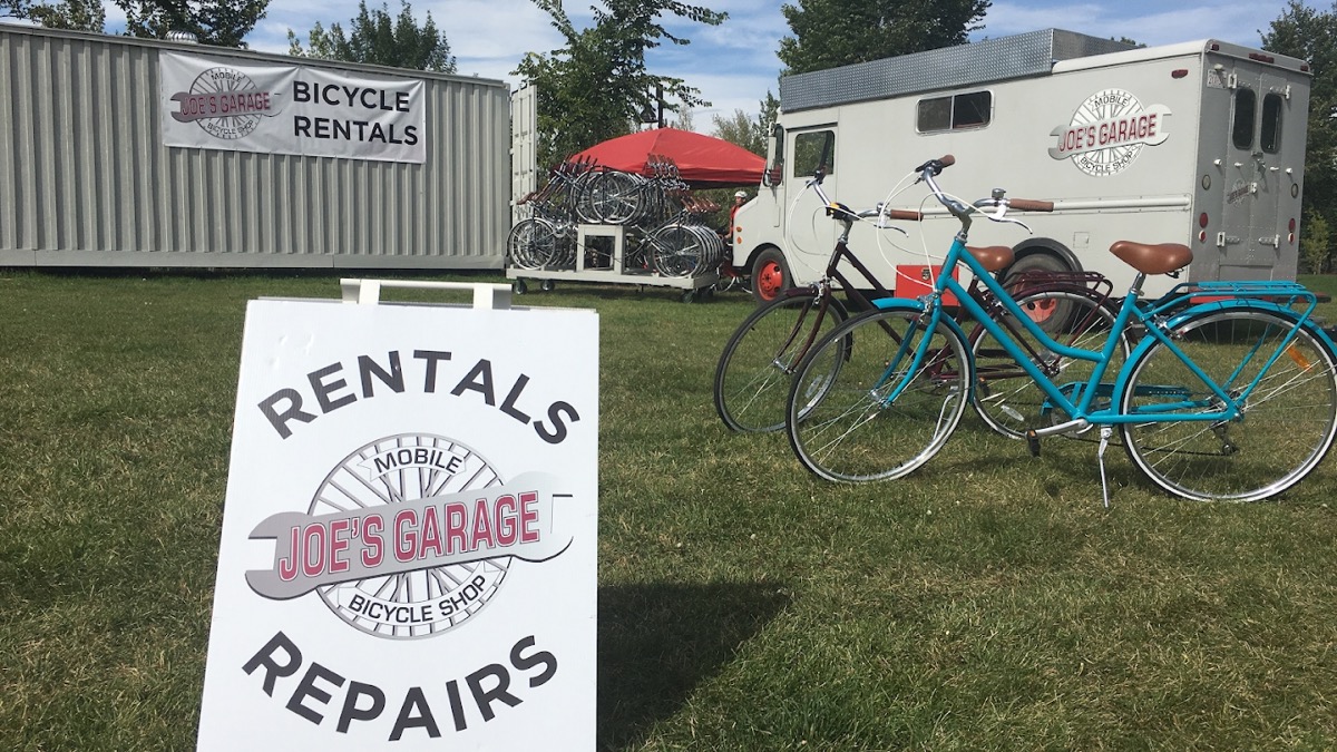 Joe's Garage Rentals & Repairs sign with bikes and the container shop